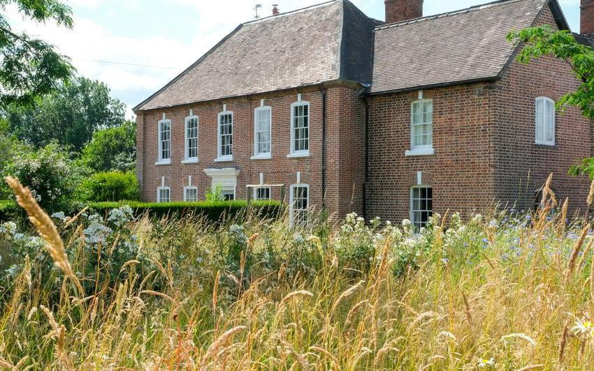 David Austin's house in Shropshire with Kew Garden's in a meadow.